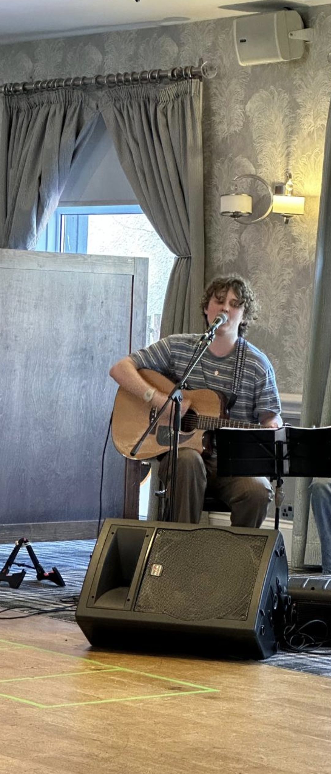 Ross performing acoustic guitar at wedding reception in Scotland